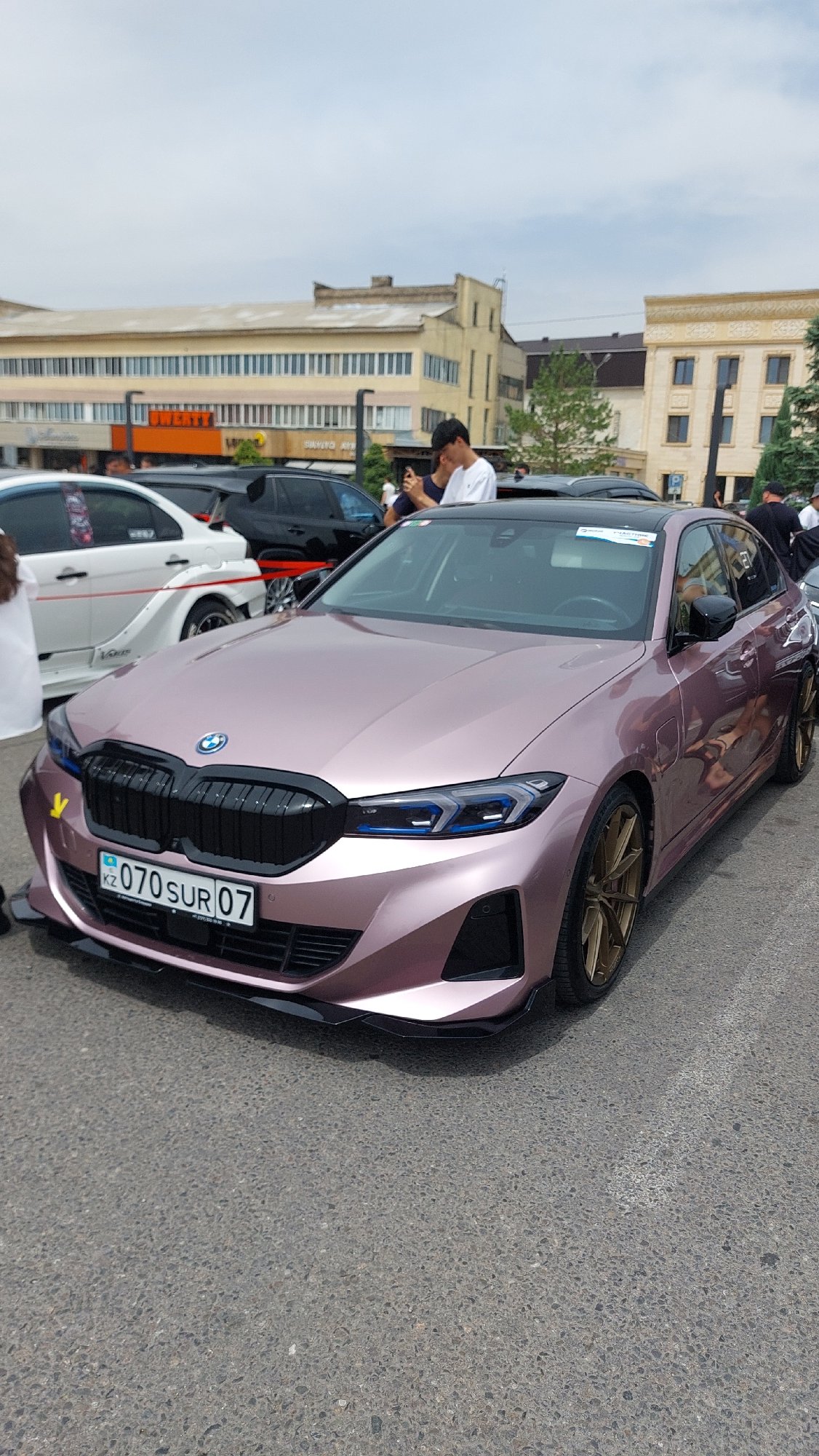 Car show features vintage and modified vehicles in Taraz
