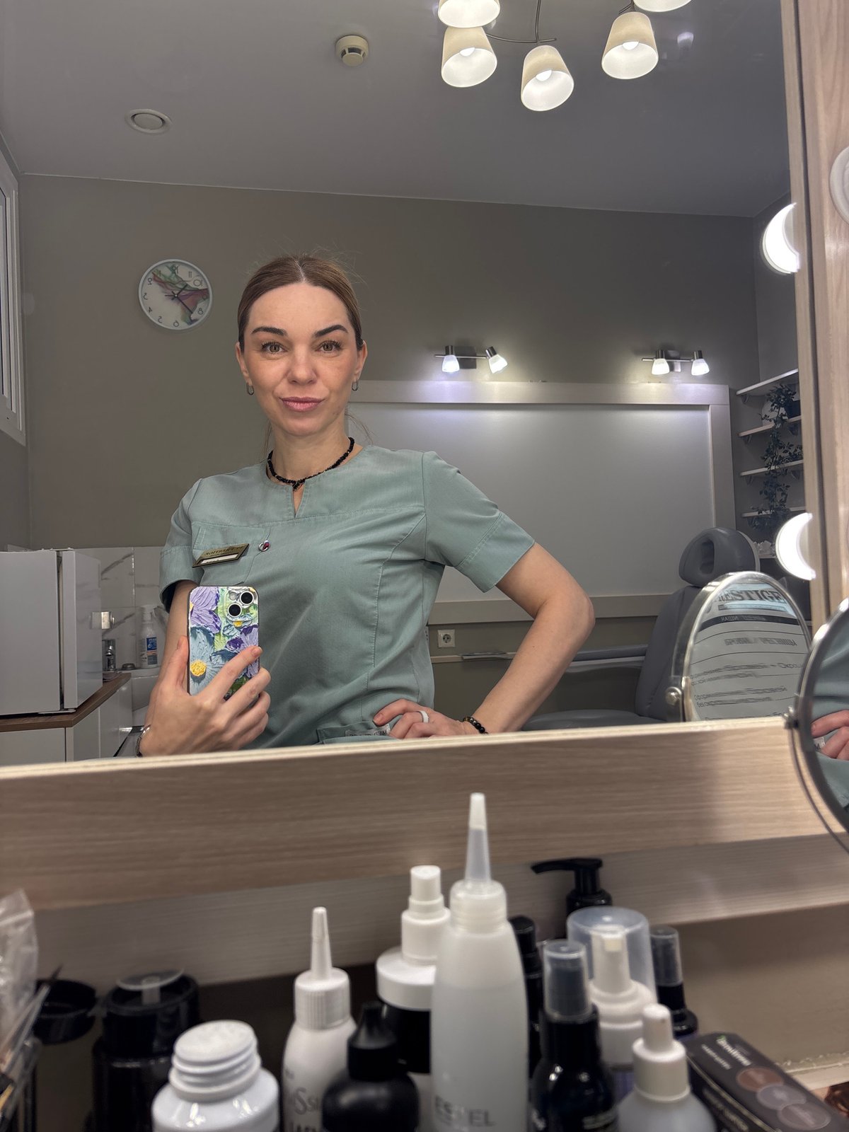 Healthcare worker documents shift with mirror selfies in scrubs