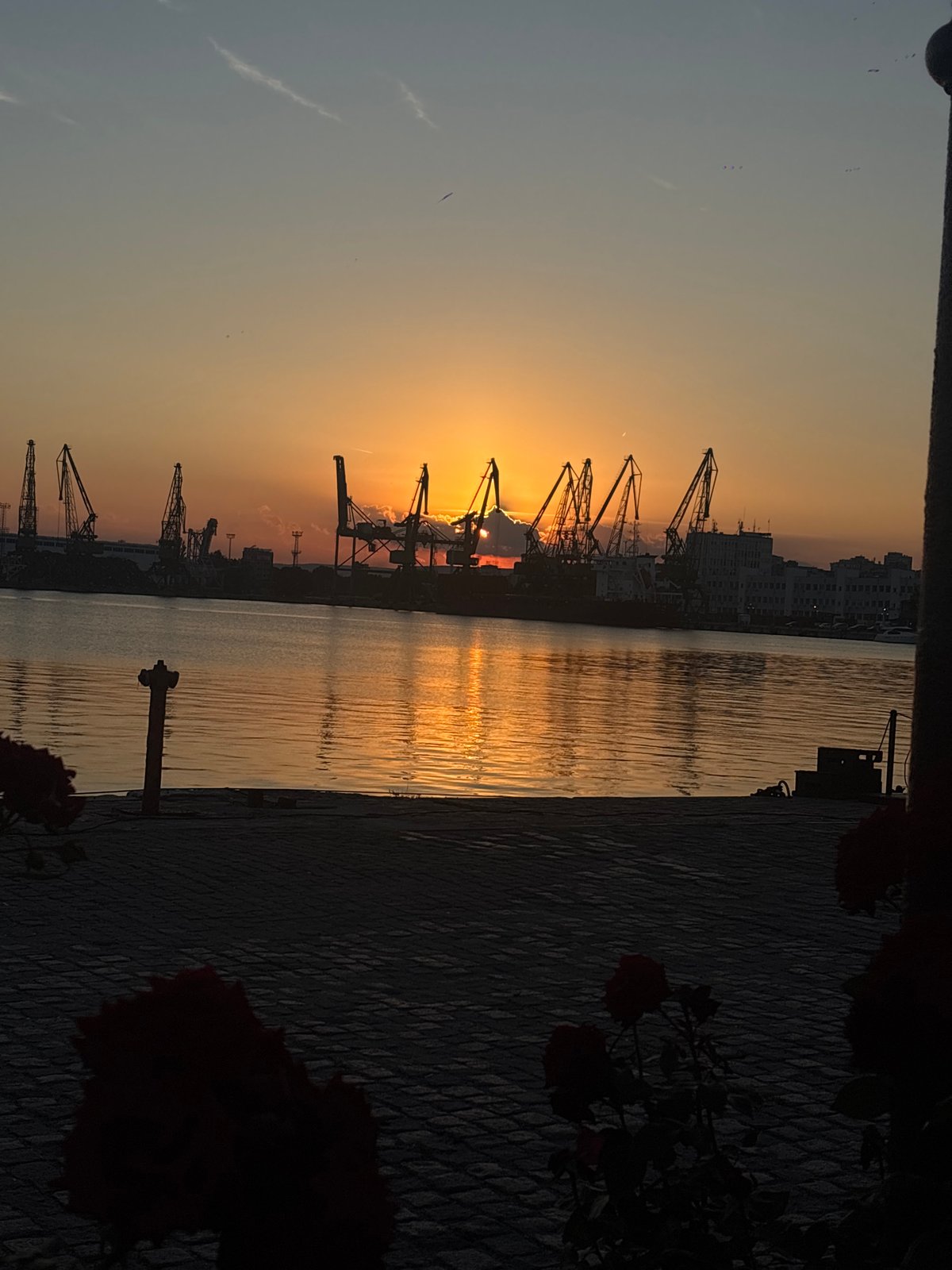 Varna's waterfront at golden hour, port and promenade