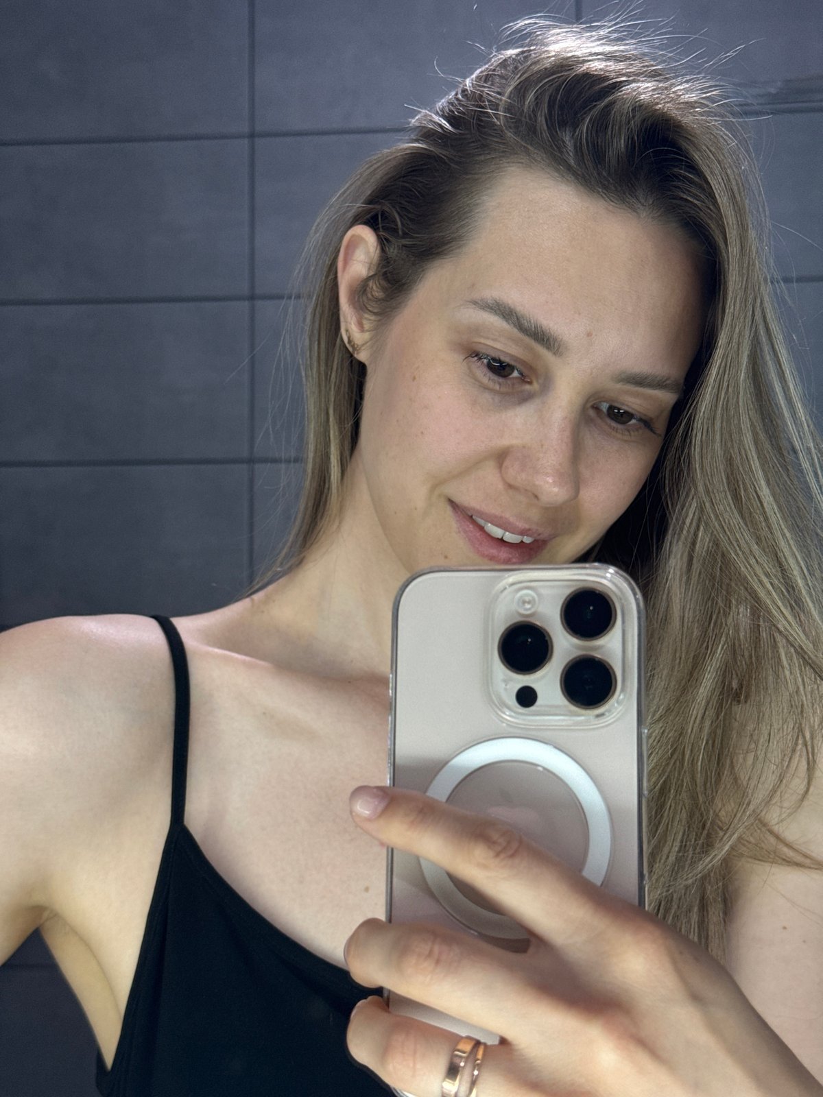 Woman takes selfies indoors in Chaikovsky, Russia