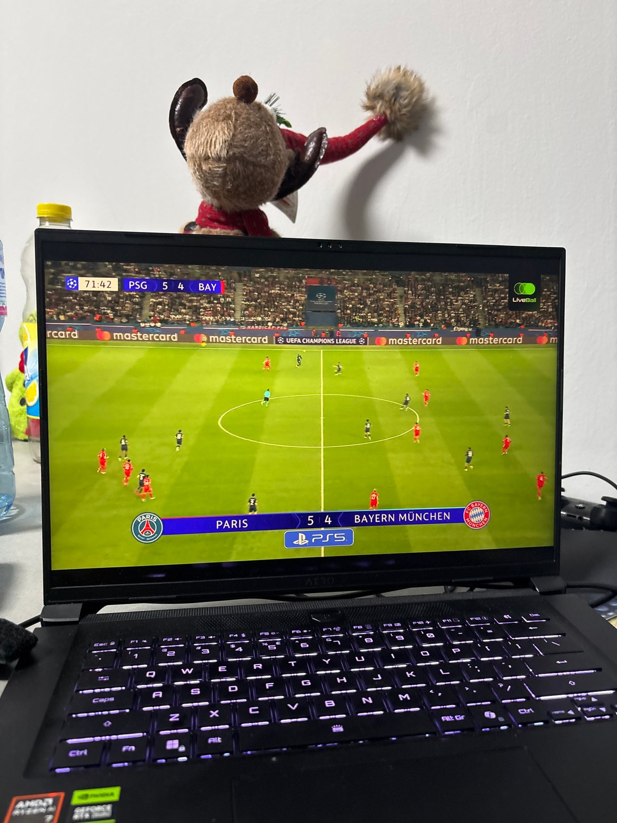 Person watches PSG vs Bayern football video game in Plovdiv