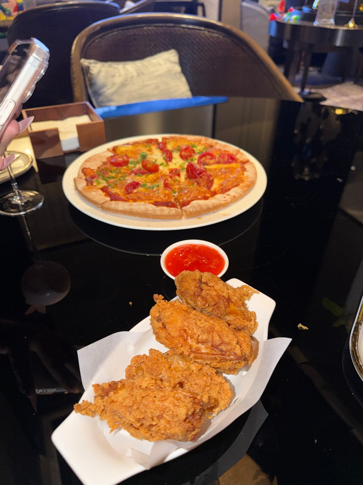 Pizza and fried chicken on a table in Jiangning District