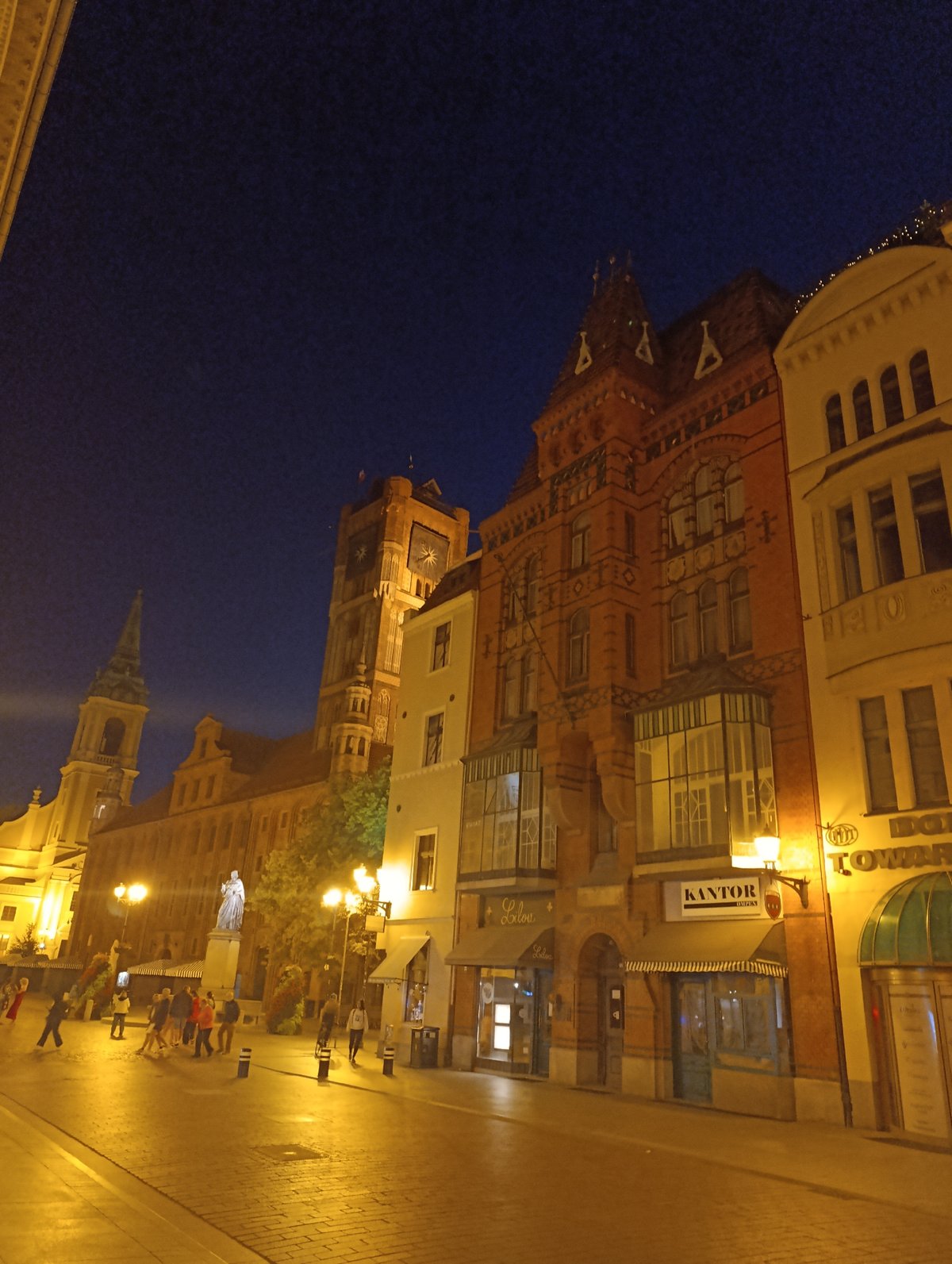 Toruń's Old Town at dusk, Gothic streets and café life