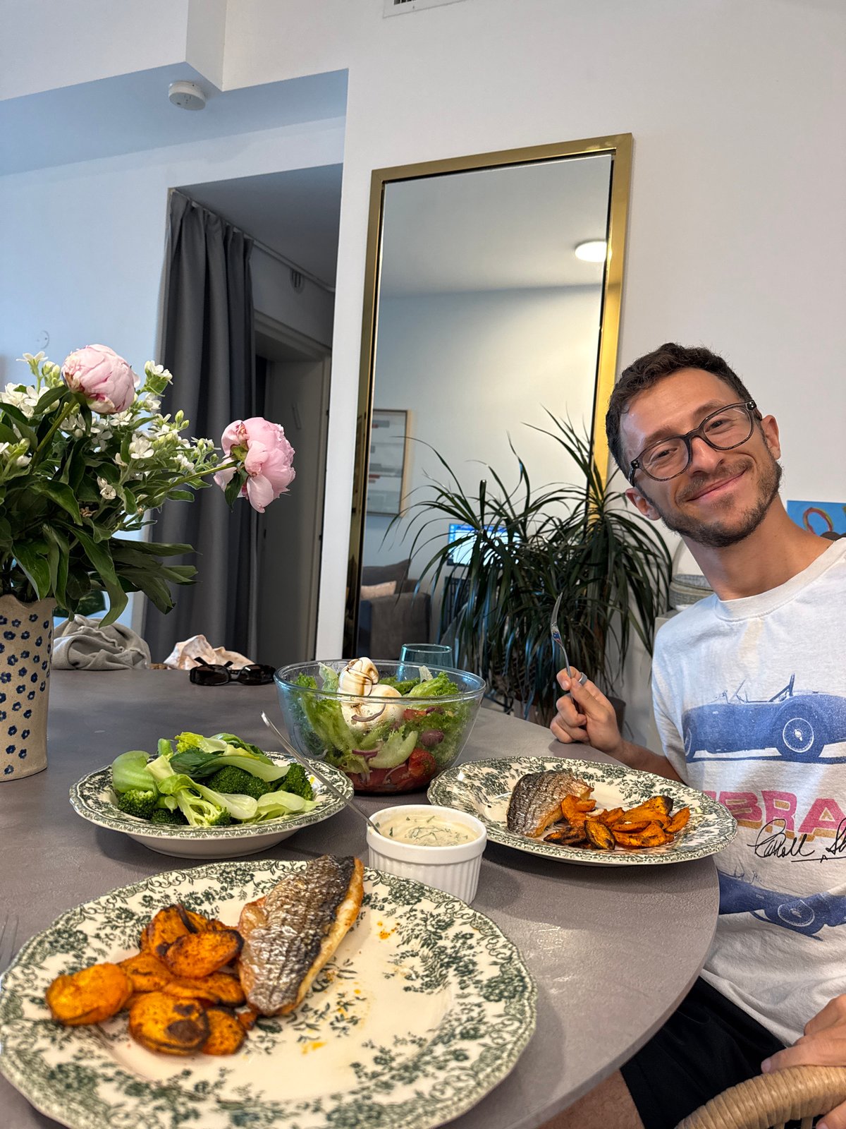 Man with glasses observed dining at Tel Aviv apartment table