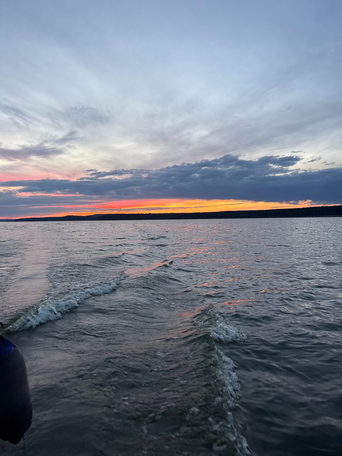 Evening boat ride on the water near Votkinsk at sunset