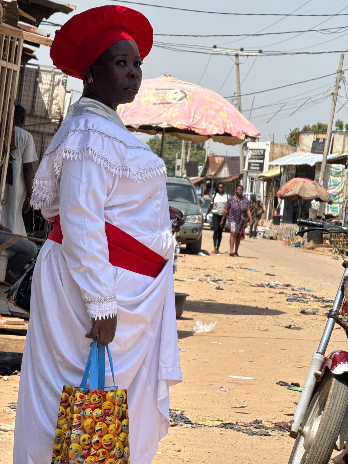 Morning foot traffic and street life in an Abuja market
