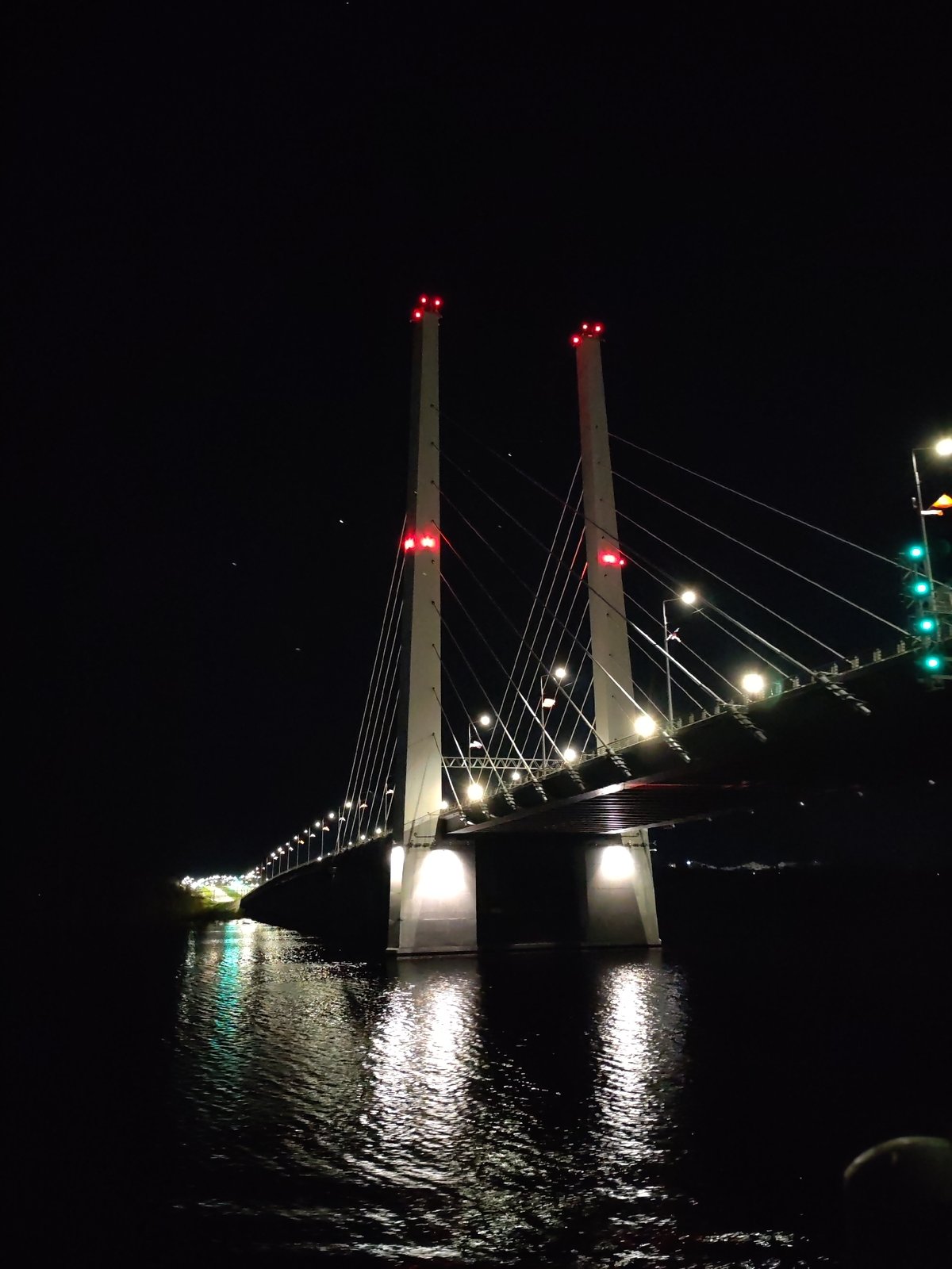 Nighttime documentation of illuminated October Bridge in Cherepovets, Russia