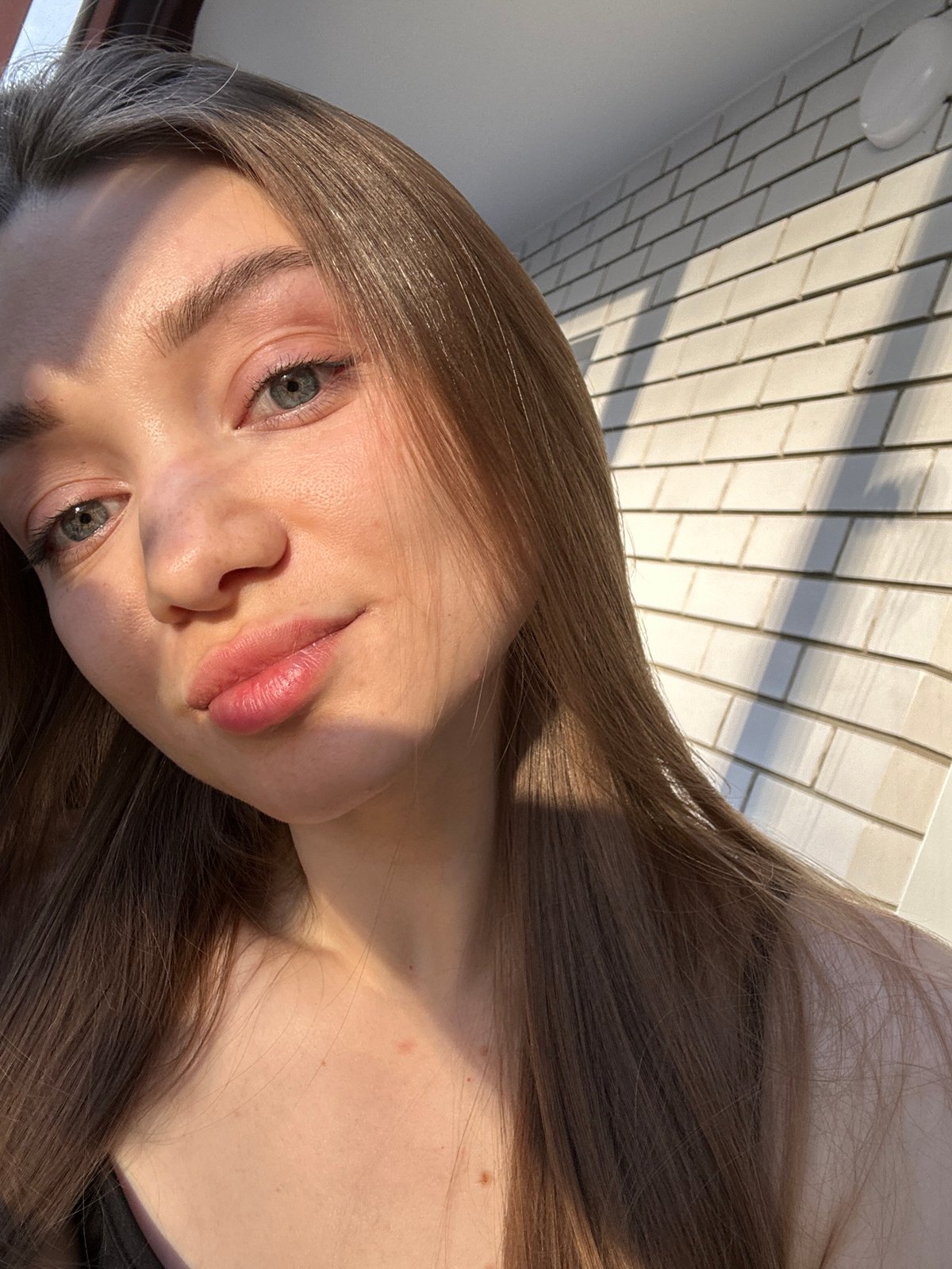 Portrait of young woman photographed in sunlight, Kazan
