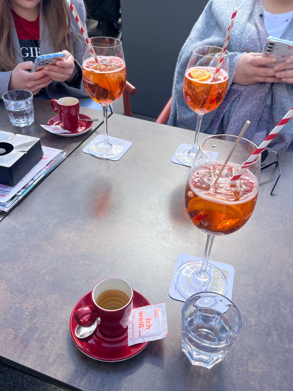 Aperol spritzes served at outdoor café in Saarbrücken