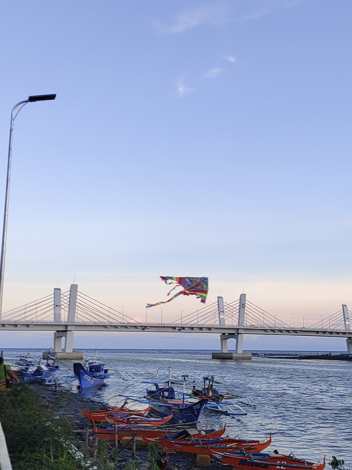 Sunset strolls along Davao City's riverside promenade captured