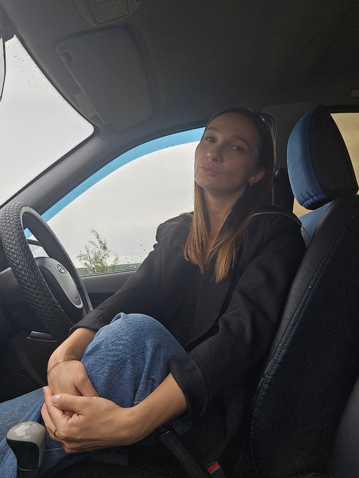 Woman photographed in driver's seat in Chaikovsky, Russia