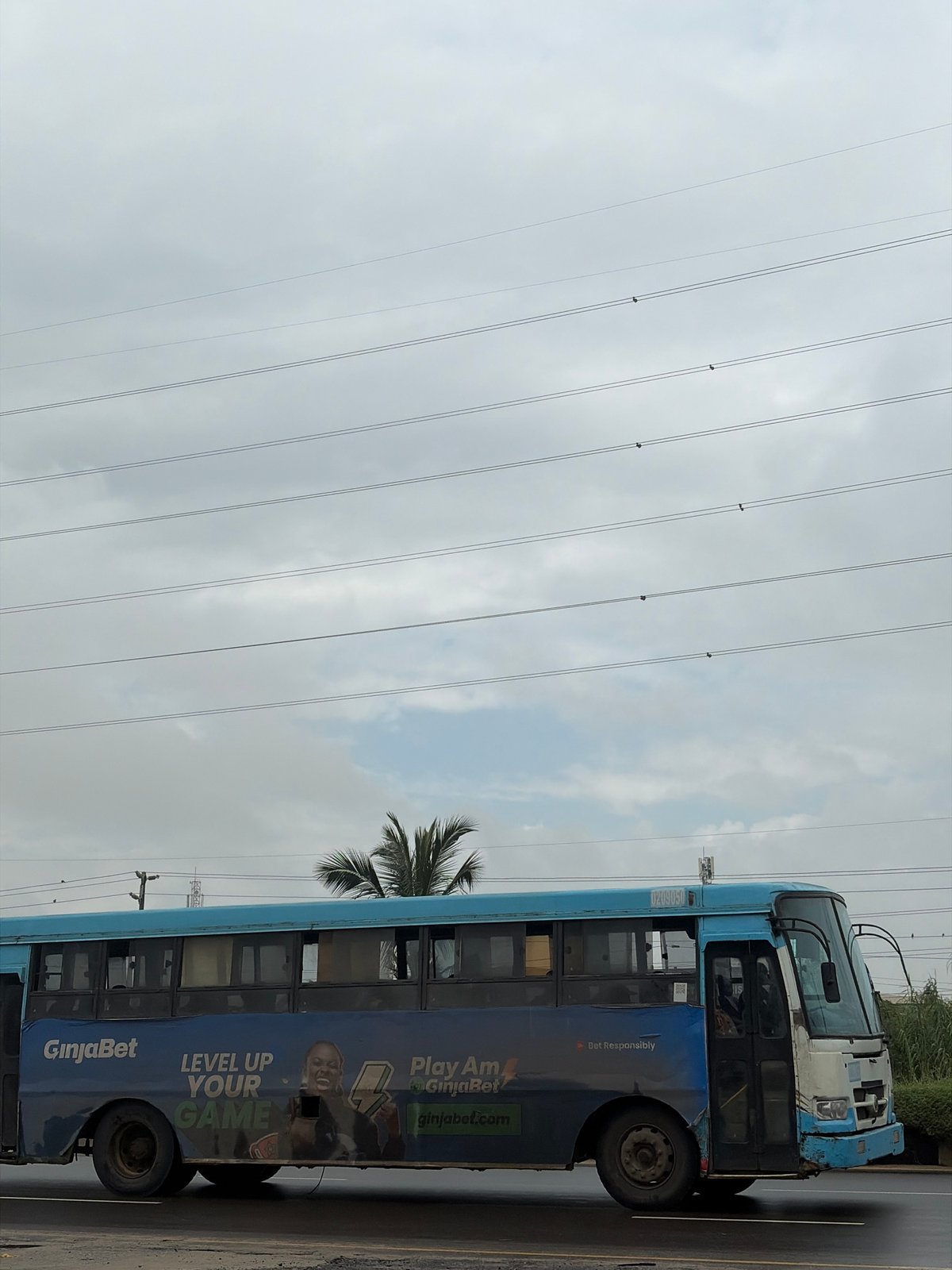 Everyday street life along a wet road in Igboefon, Nigeria