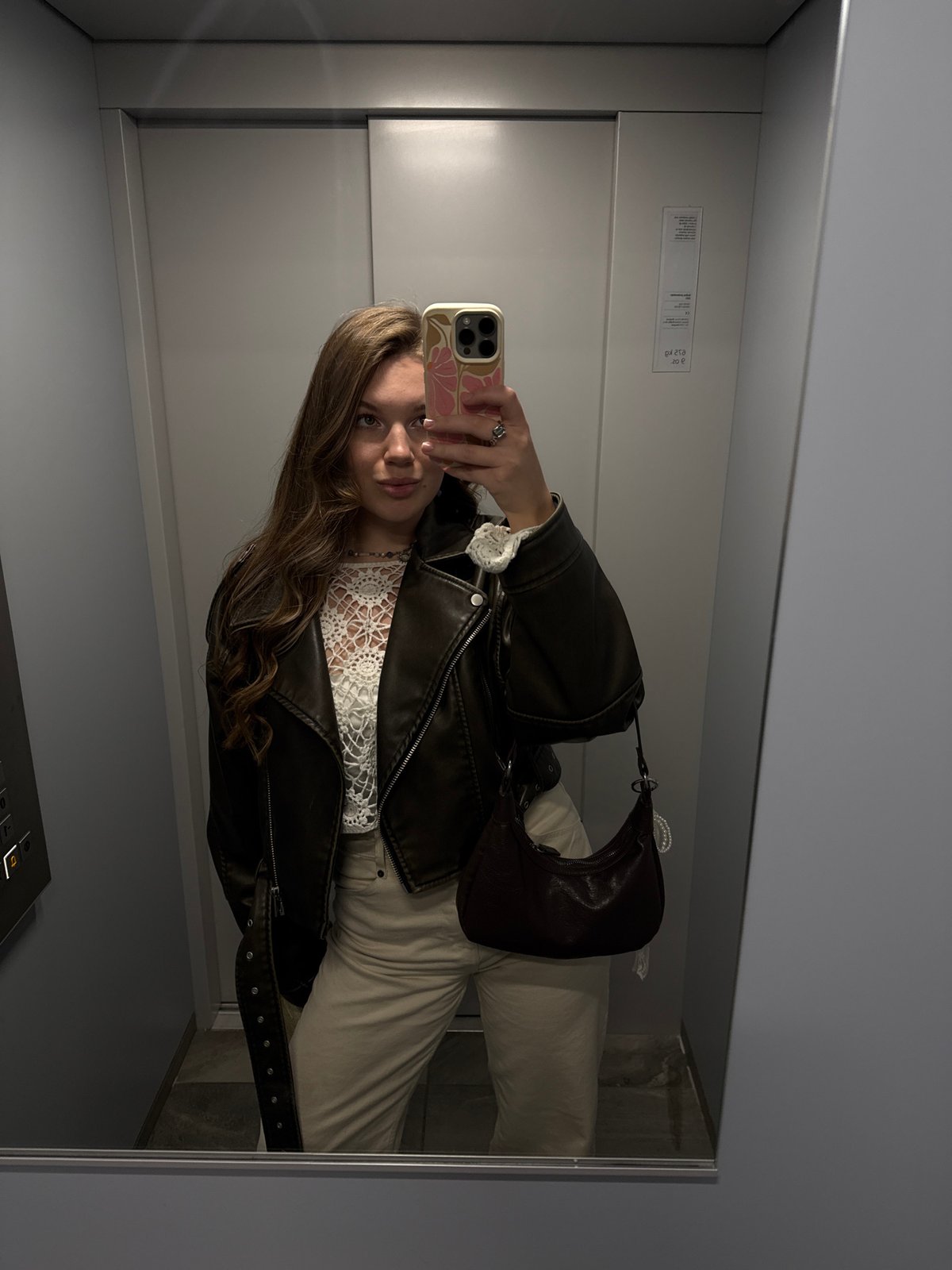 Woman Takes Mirror Selfie in Belgrade Elevator
