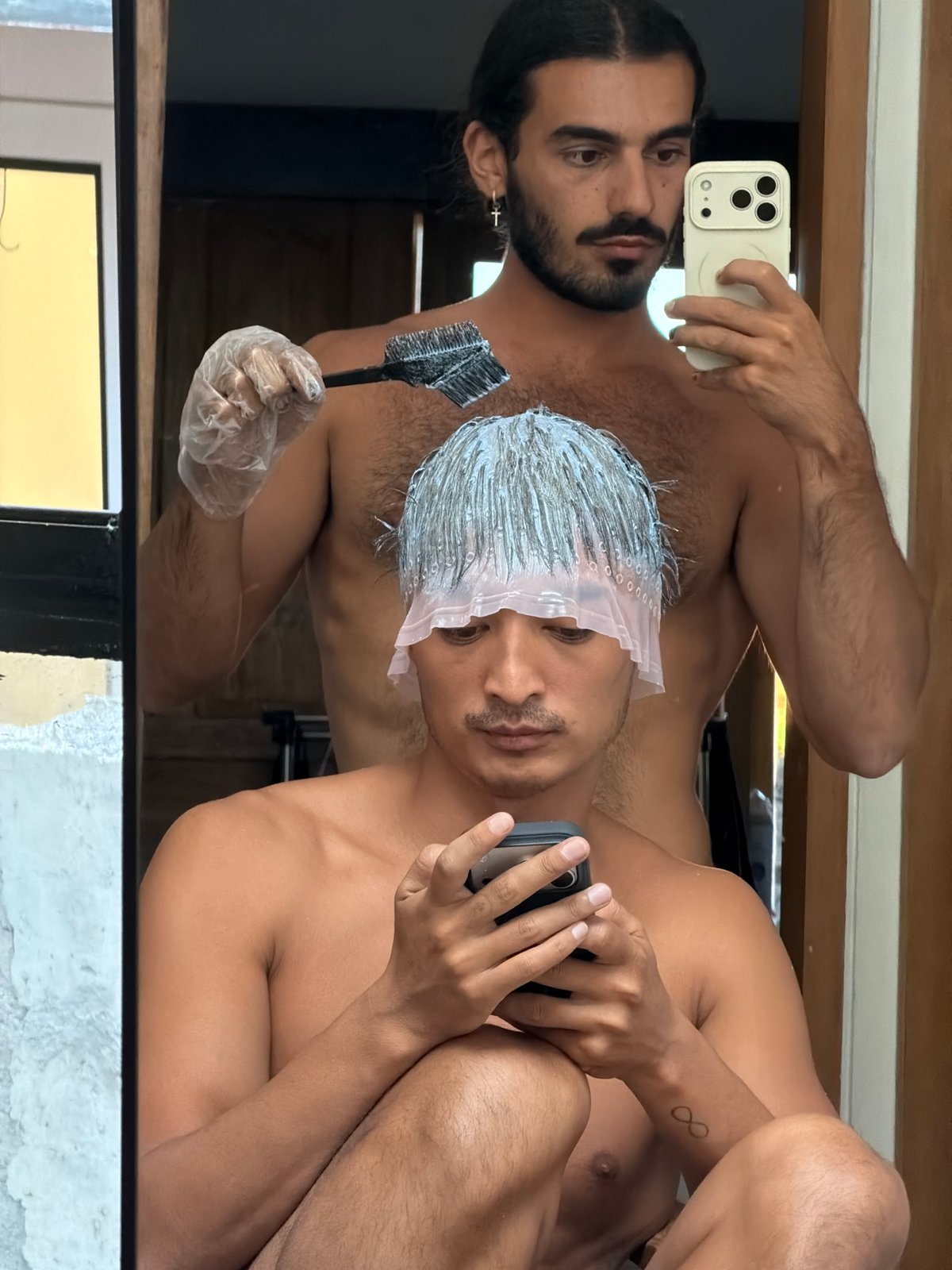 Hair dyeing session documented via selfies in North Kuta