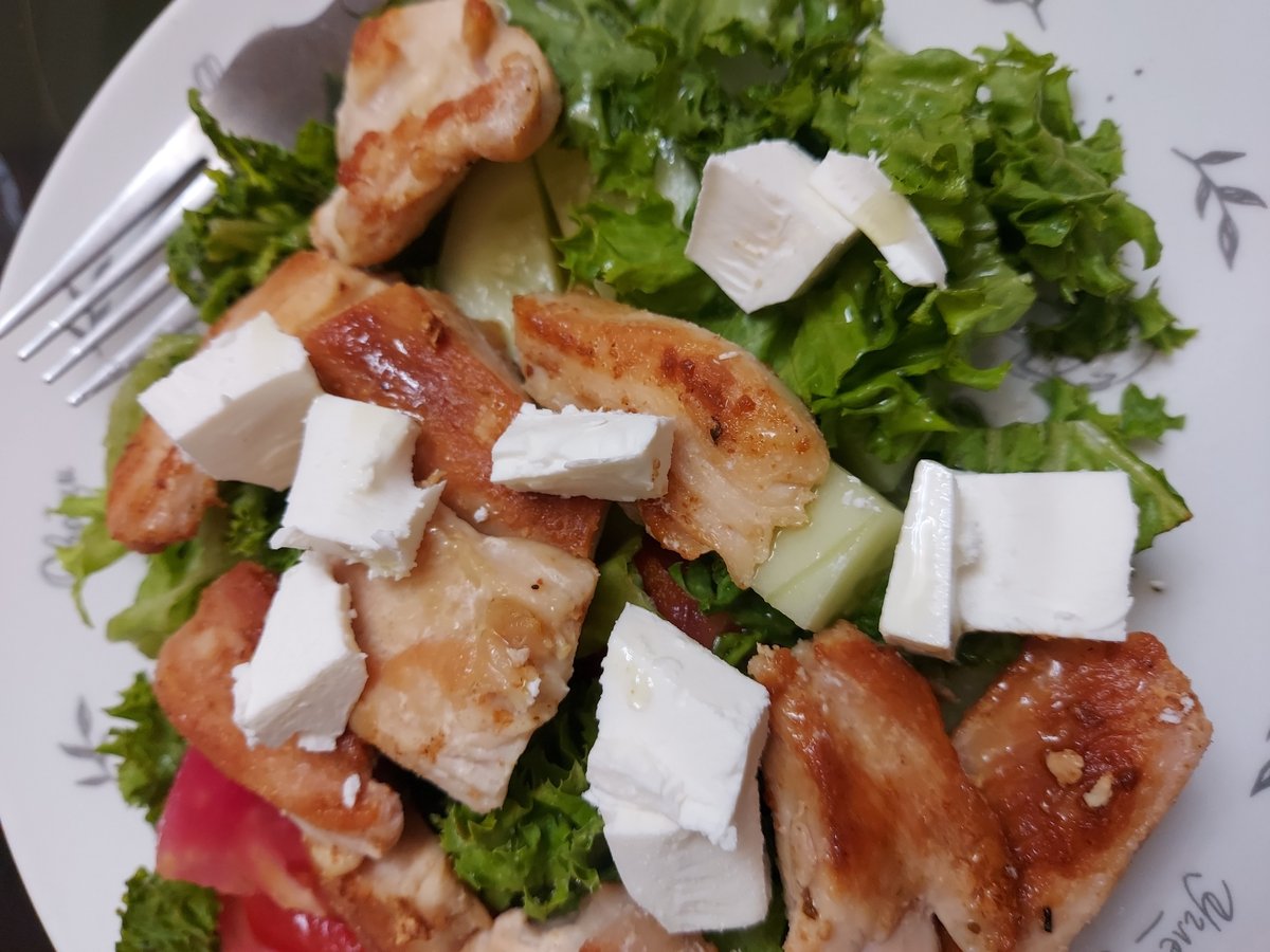 Overhead look at a grilled chicken and cheese salad