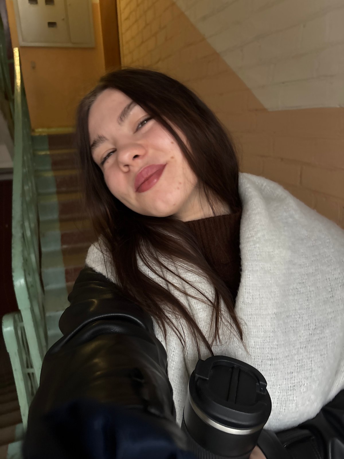 Person in white shawl photographed in Perm, Russia