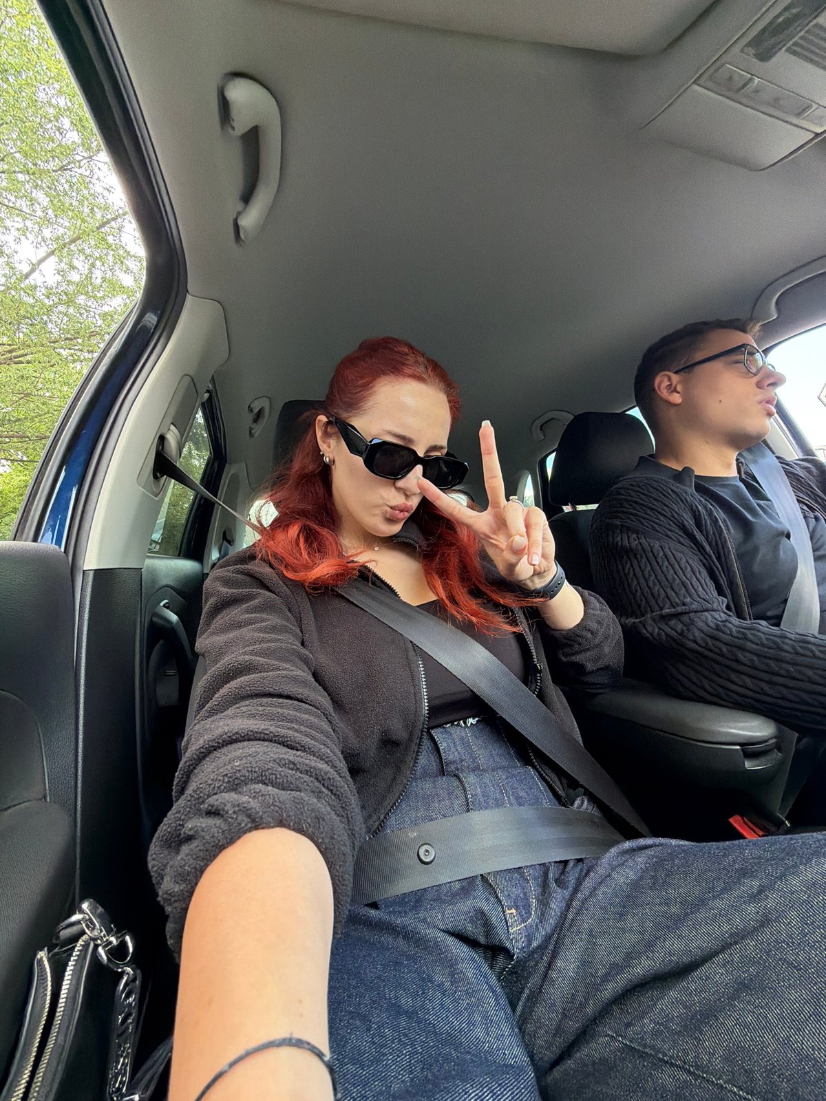 Two people photographed in car in Sofia