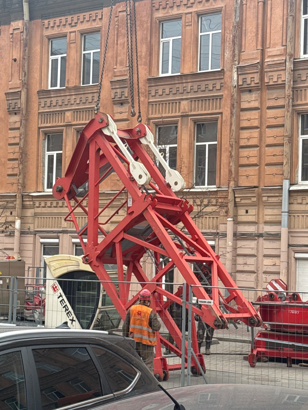 Construction crane and gothic spire documented in Saint Petersburg