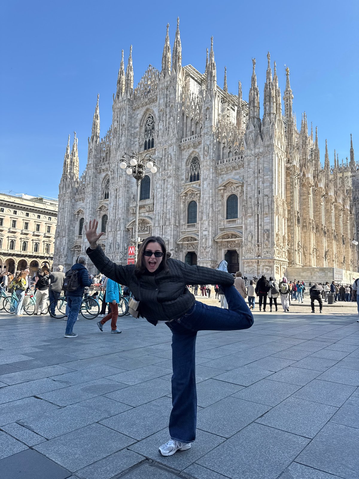 Tourists document Milan's iconic landmarks during morning sightseeing