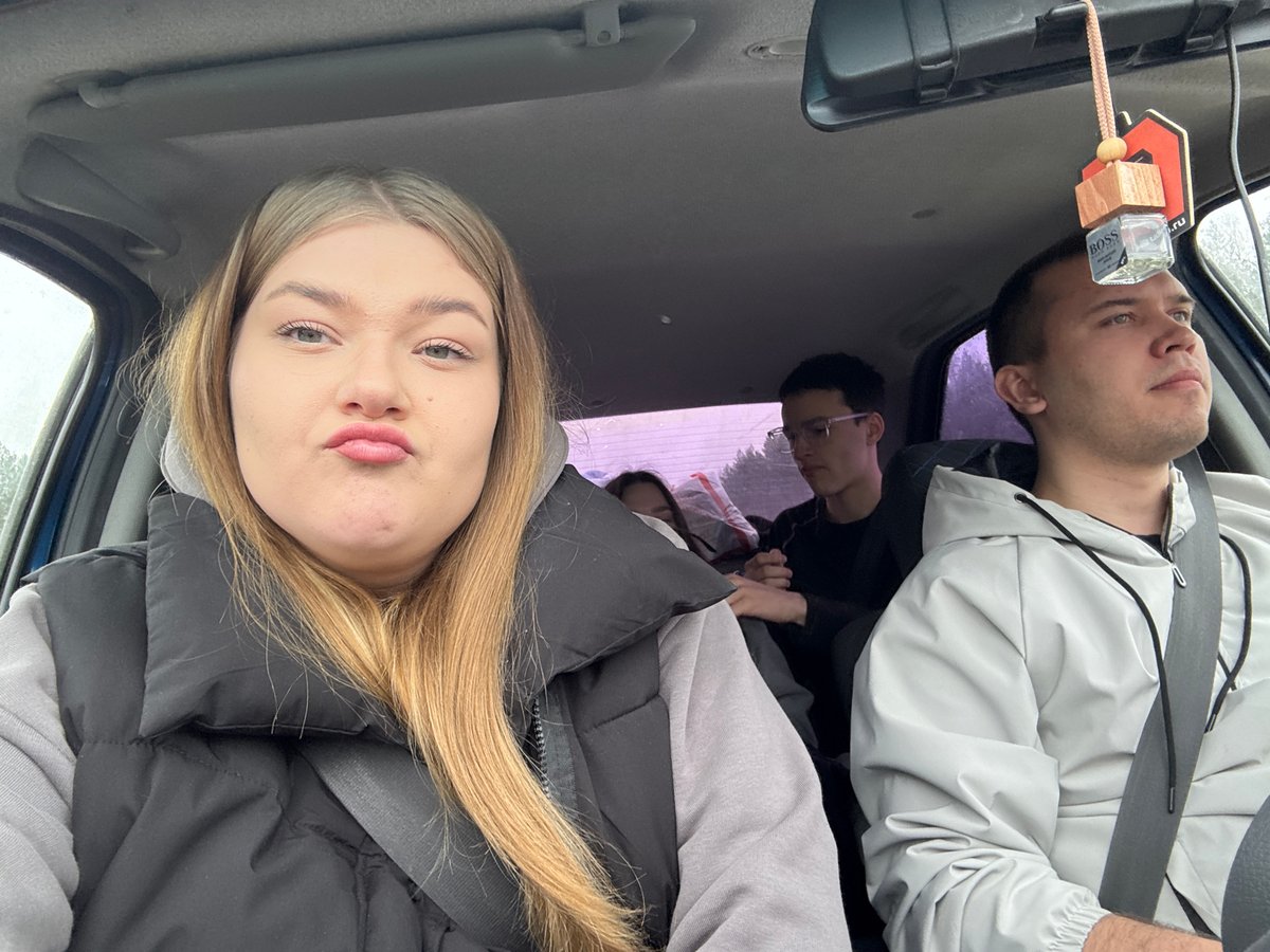 Family travels through snowy Russian countryside by vehicle