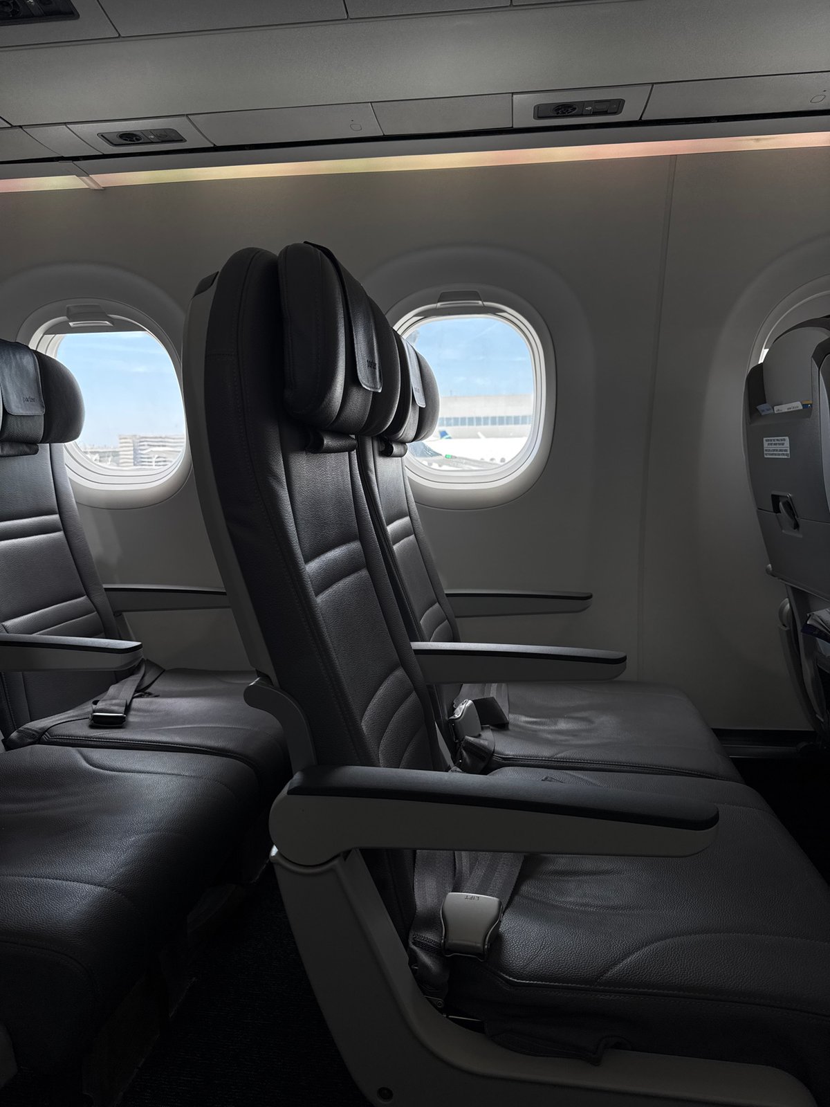 Passenger documents empty aircraft cabin and tarmac in LA