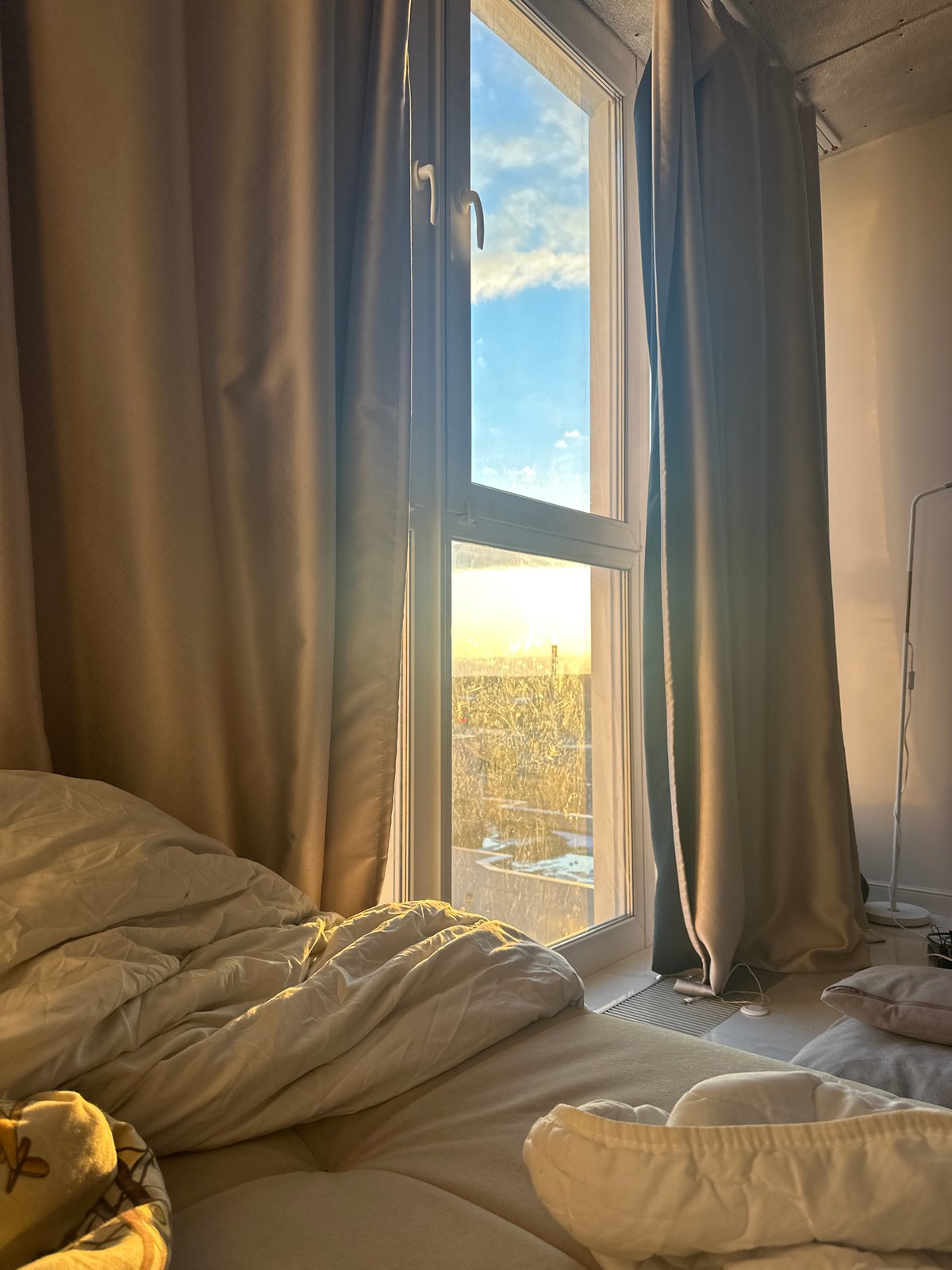 Moscow resident games in sunlit bedroom during afternoon hours
