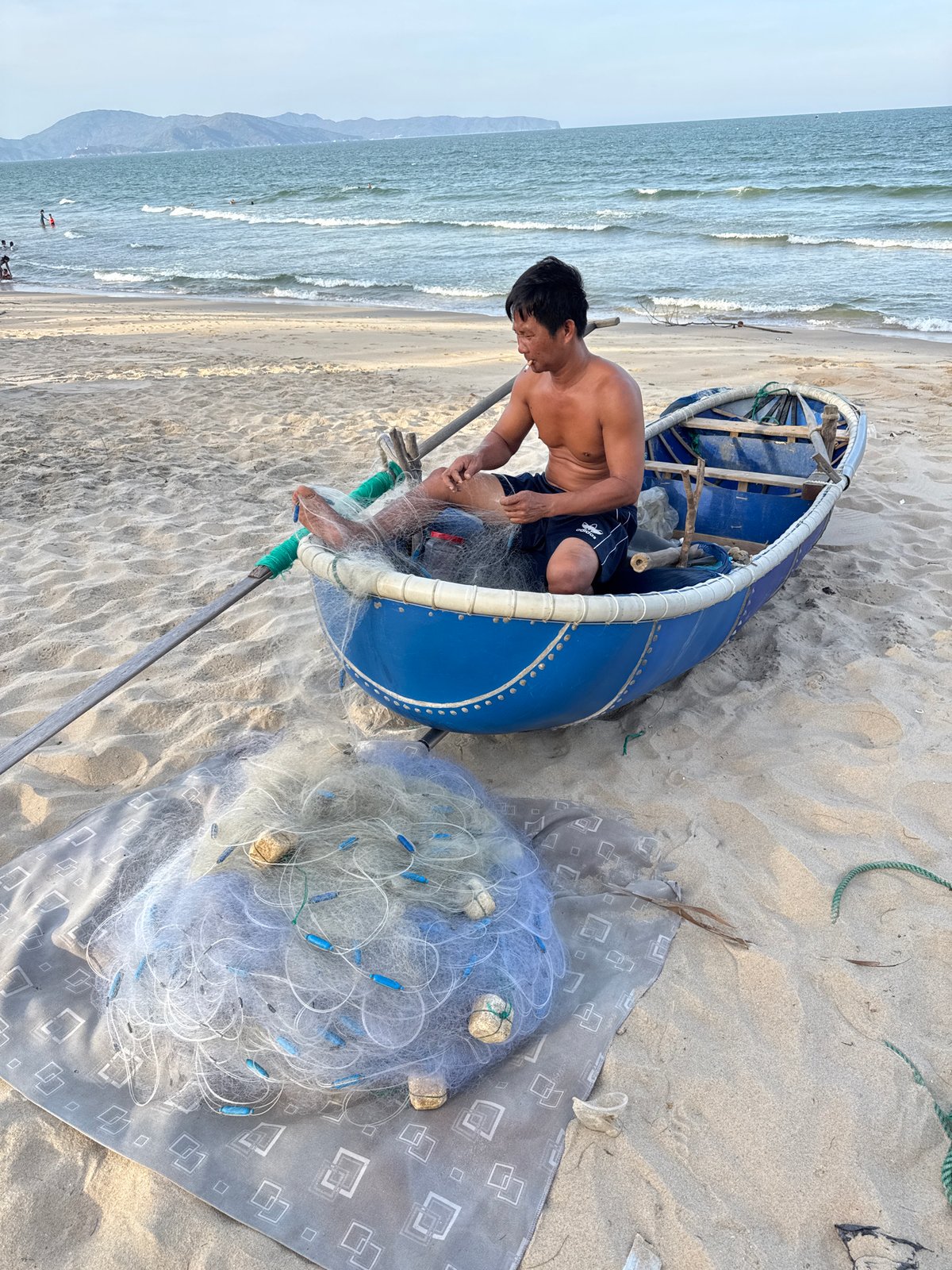 Morning beach life in South Quy Nhon — fishing, play, and shoreline details