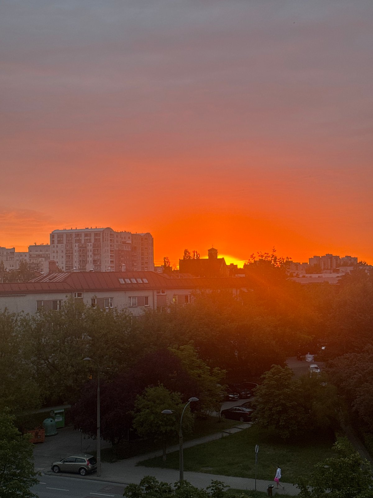 Warm sunset colors over Warsaw rooftops