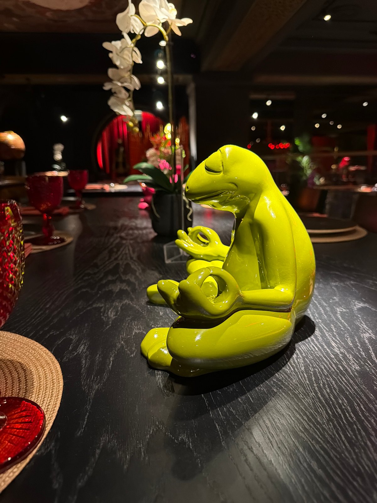 Moscow bar interior captured with decorative sculptures, patrons