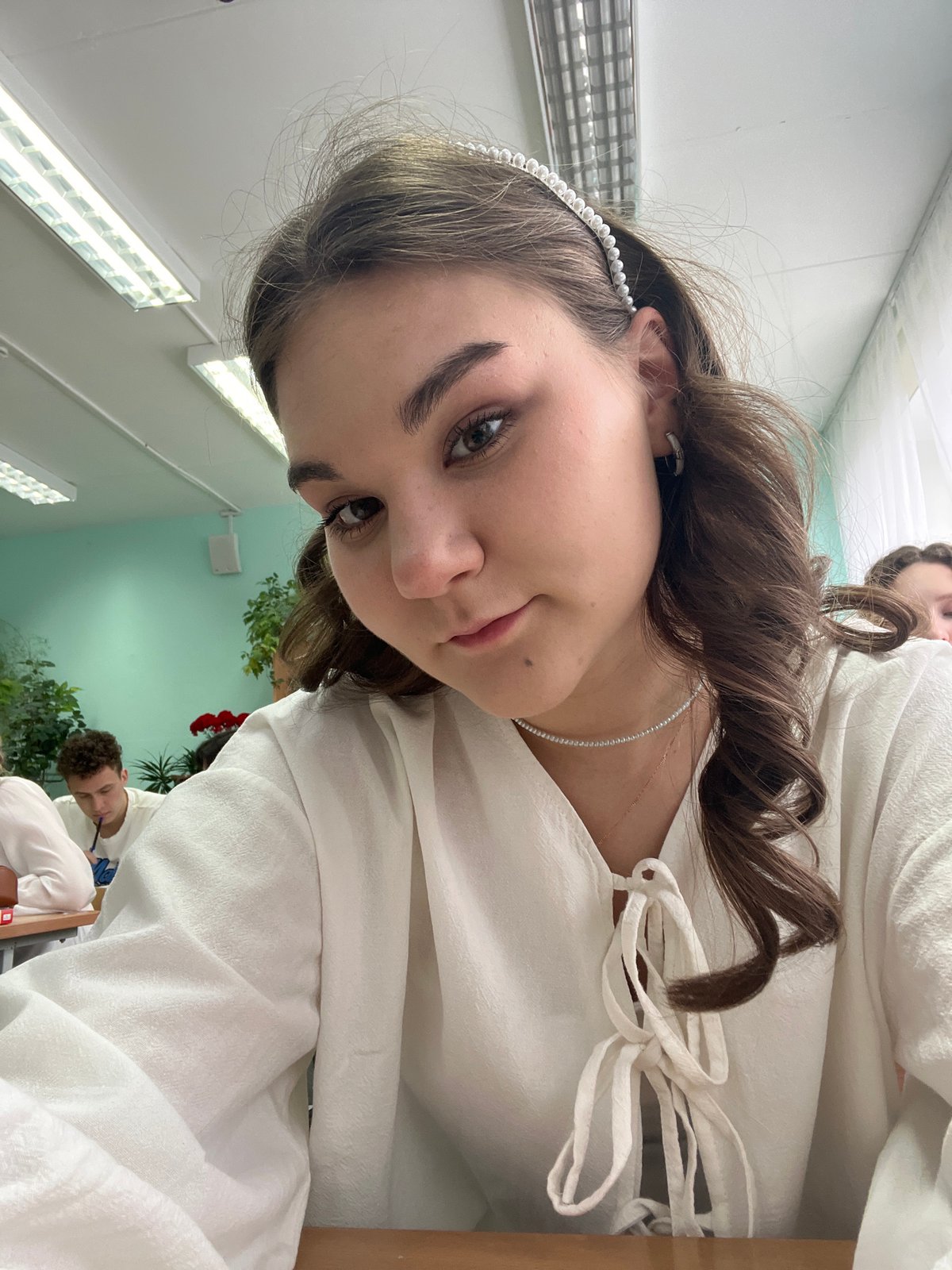 Portrait of young woman in vintage attire captured in Chaikovsky