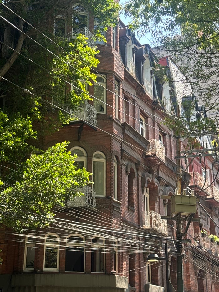 Workers maintain Mexico City infrastructure amid colonial architecture documentation