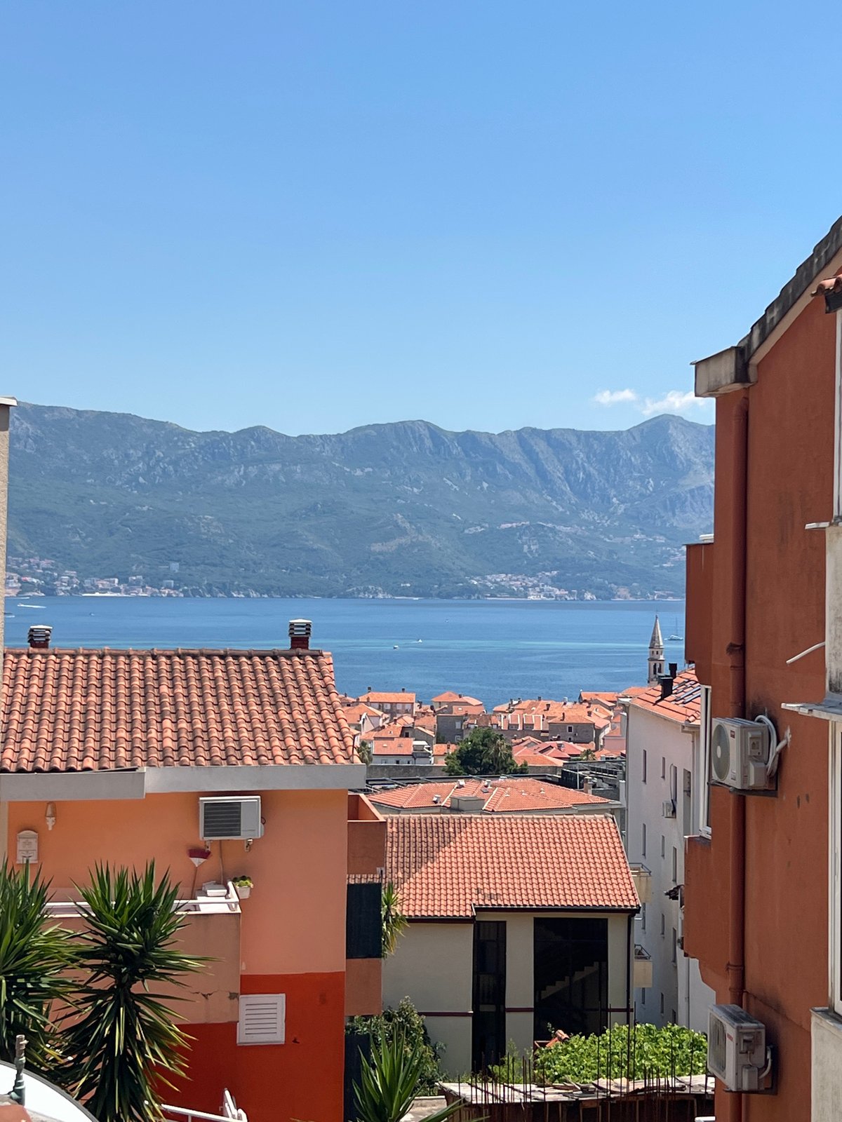 Budva on a summer morning, beaches full and streets busy