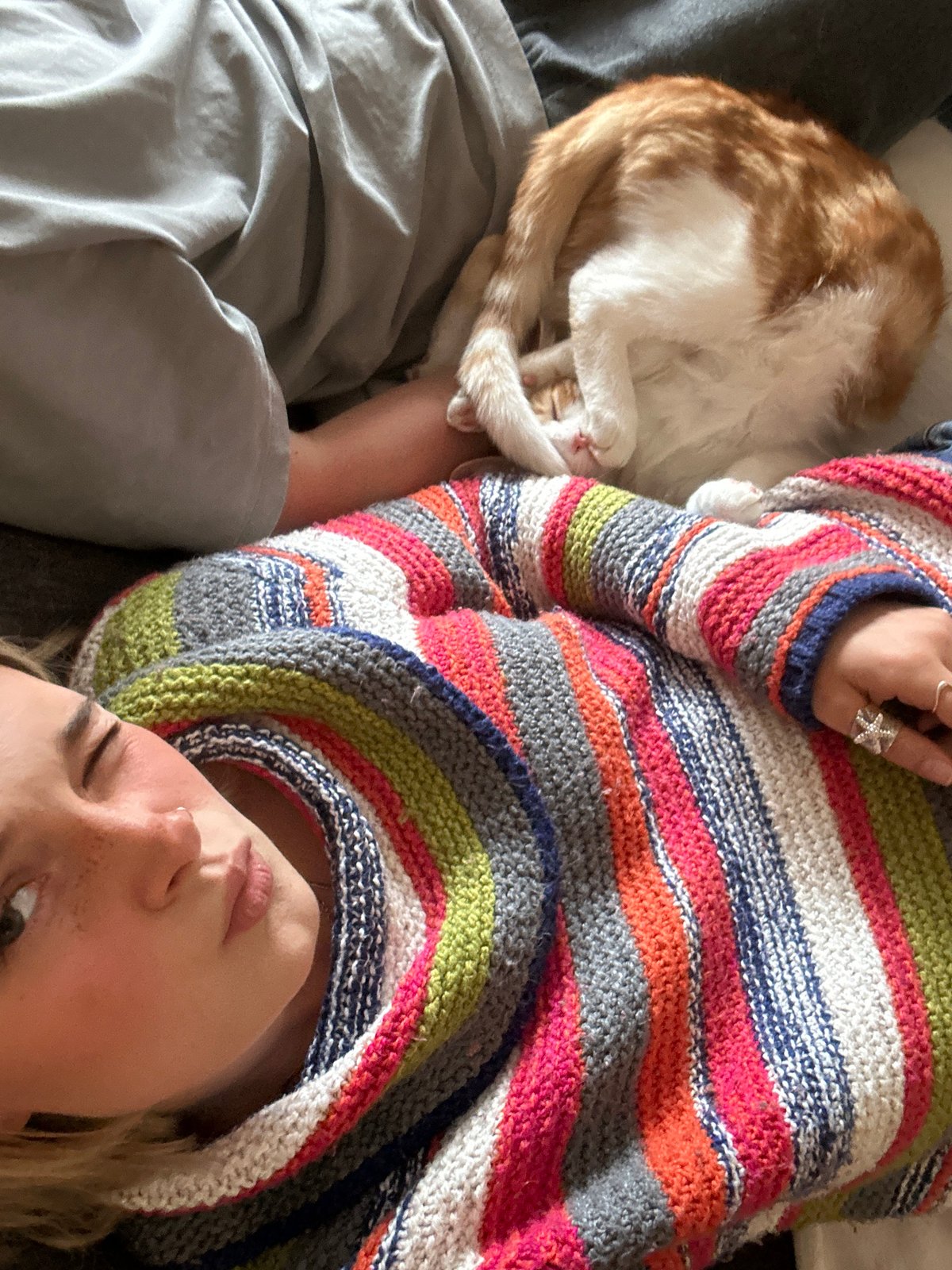 Woman spends quiet moments with cats in Squamish home