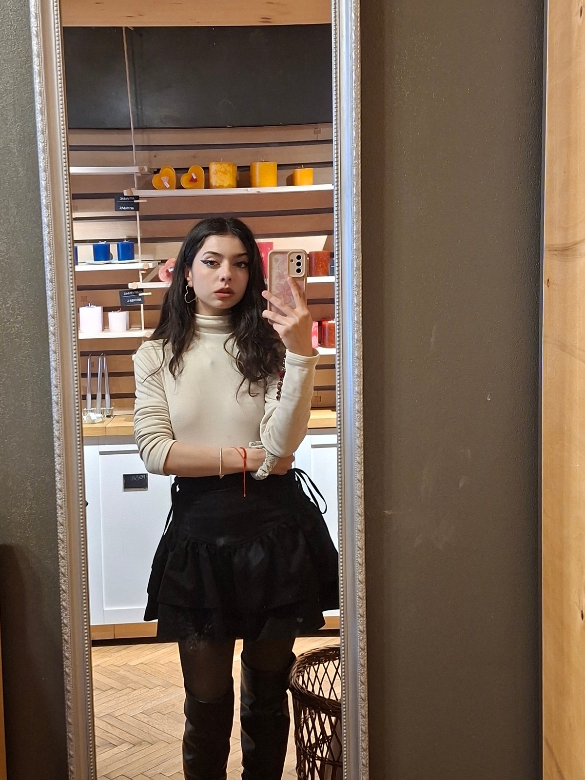 Mirror selfie captured showing person in casual outfit