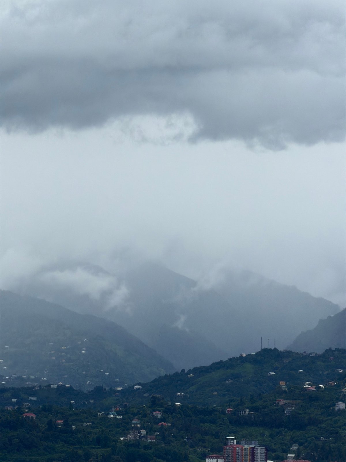 Batumi under heavy clouds, city and coastline on a grey morning