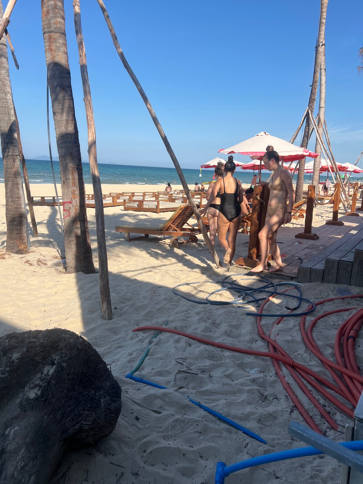 Busy morning on Da Nang's beach — water, jet skis, and shoreline crowds