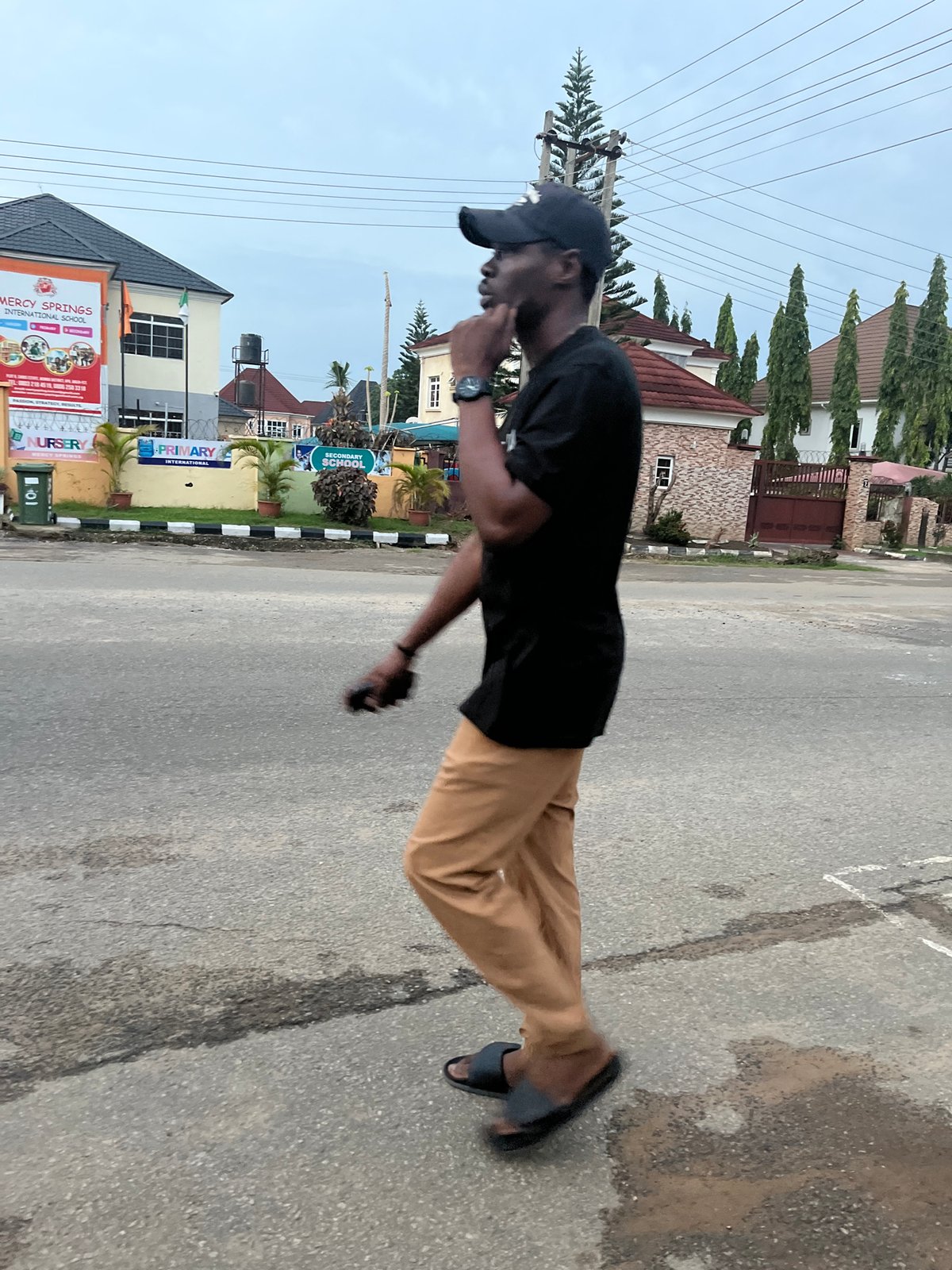 Daily street life unfolds in Abuja Nigeria afternoon