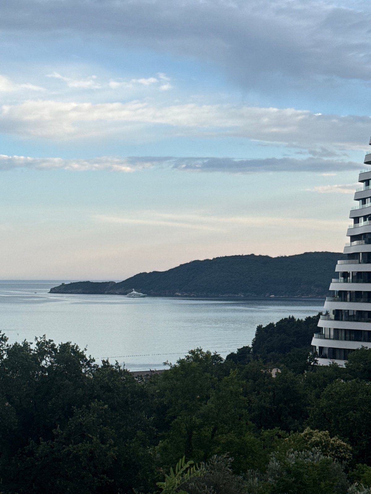 Superyacht, cranes, and coastline life in Boreti, Montenegro