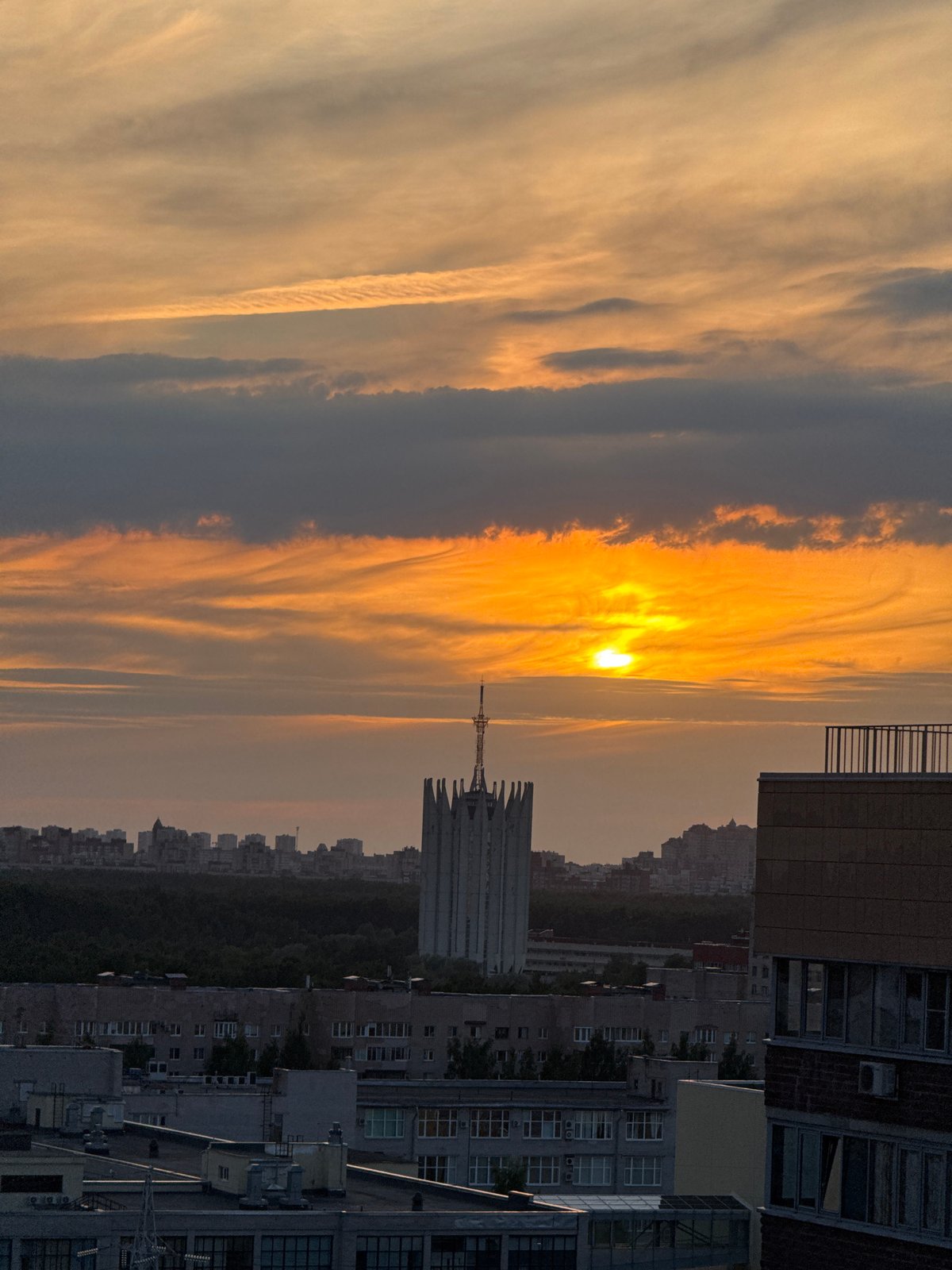 Dramatic Orange Sunset Illuminates Russian City Skyline