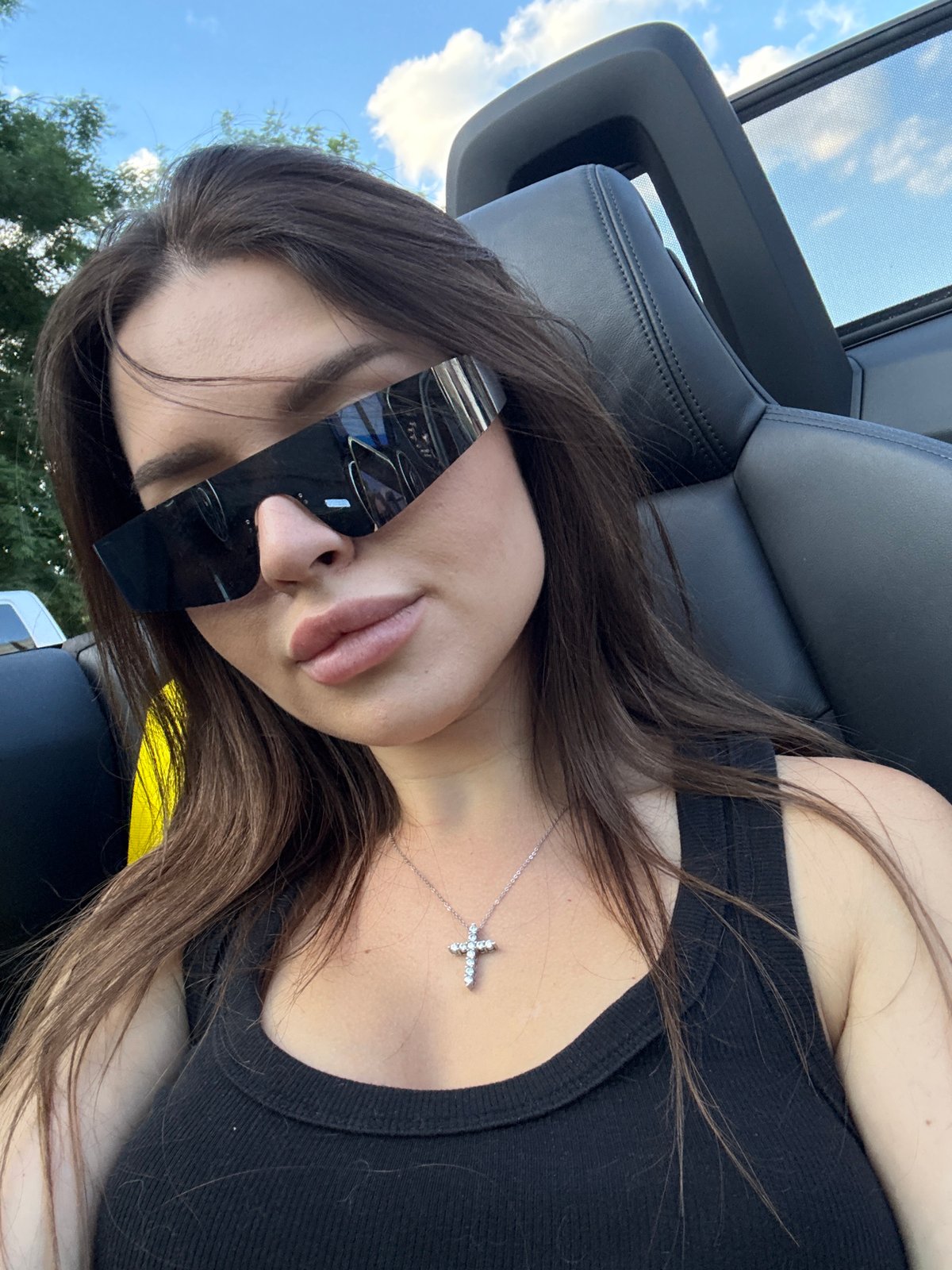 Top-down convertible ride through Prague, bold sunglasses on