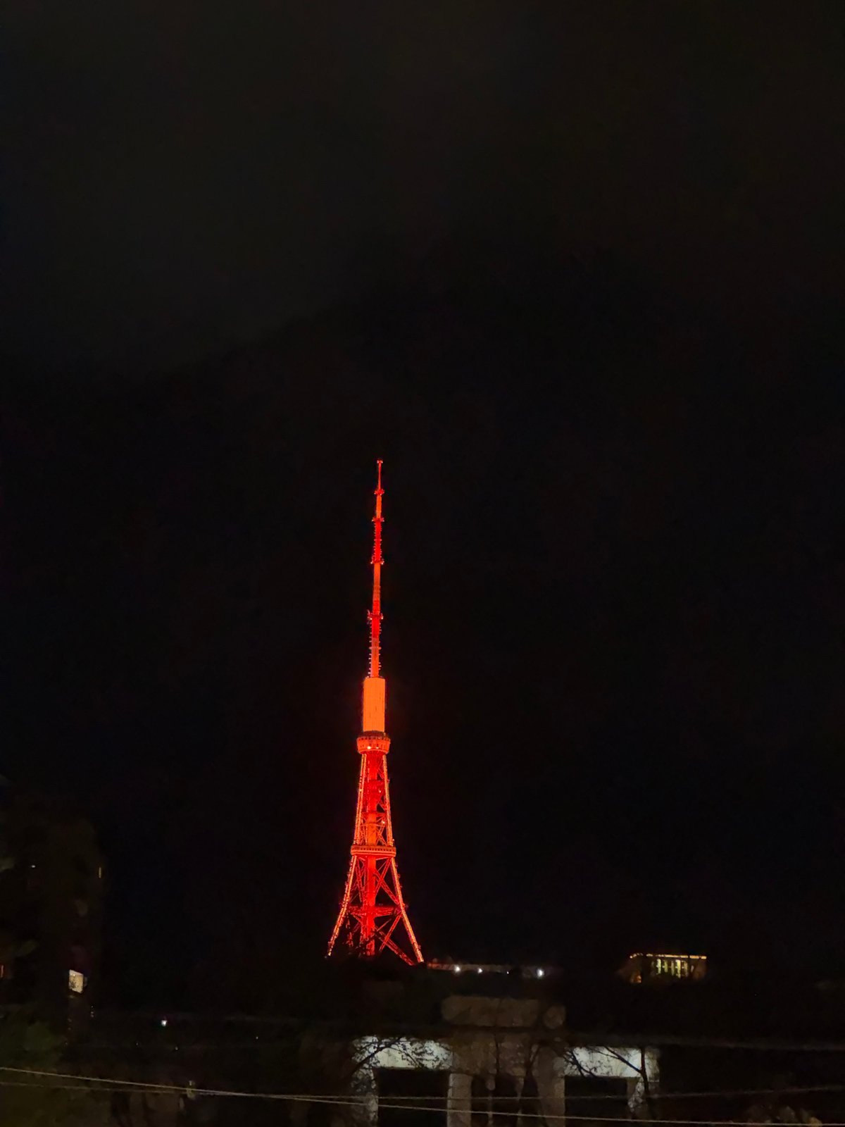 Nighttime scenes captured in Yerevan show illuminated tower, cloudy skies
