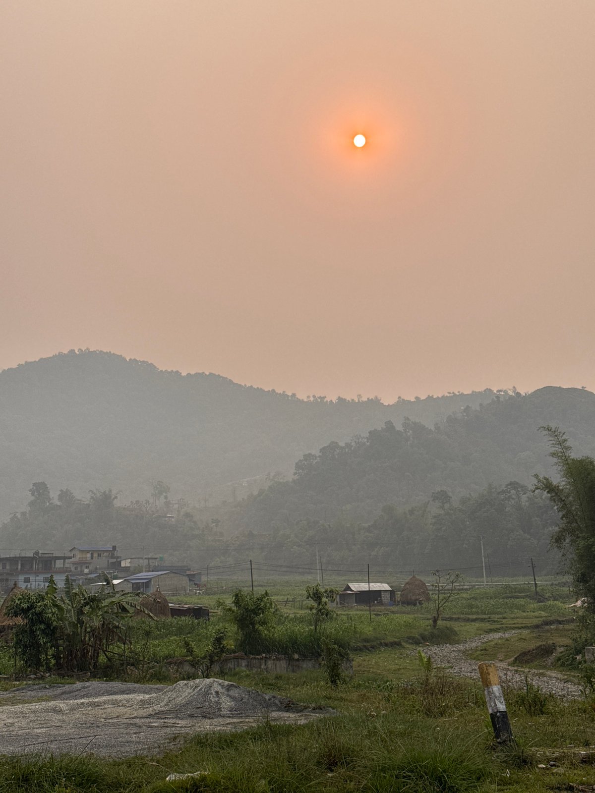 Hazy mountain landscape documented near Pokhara, Nepal