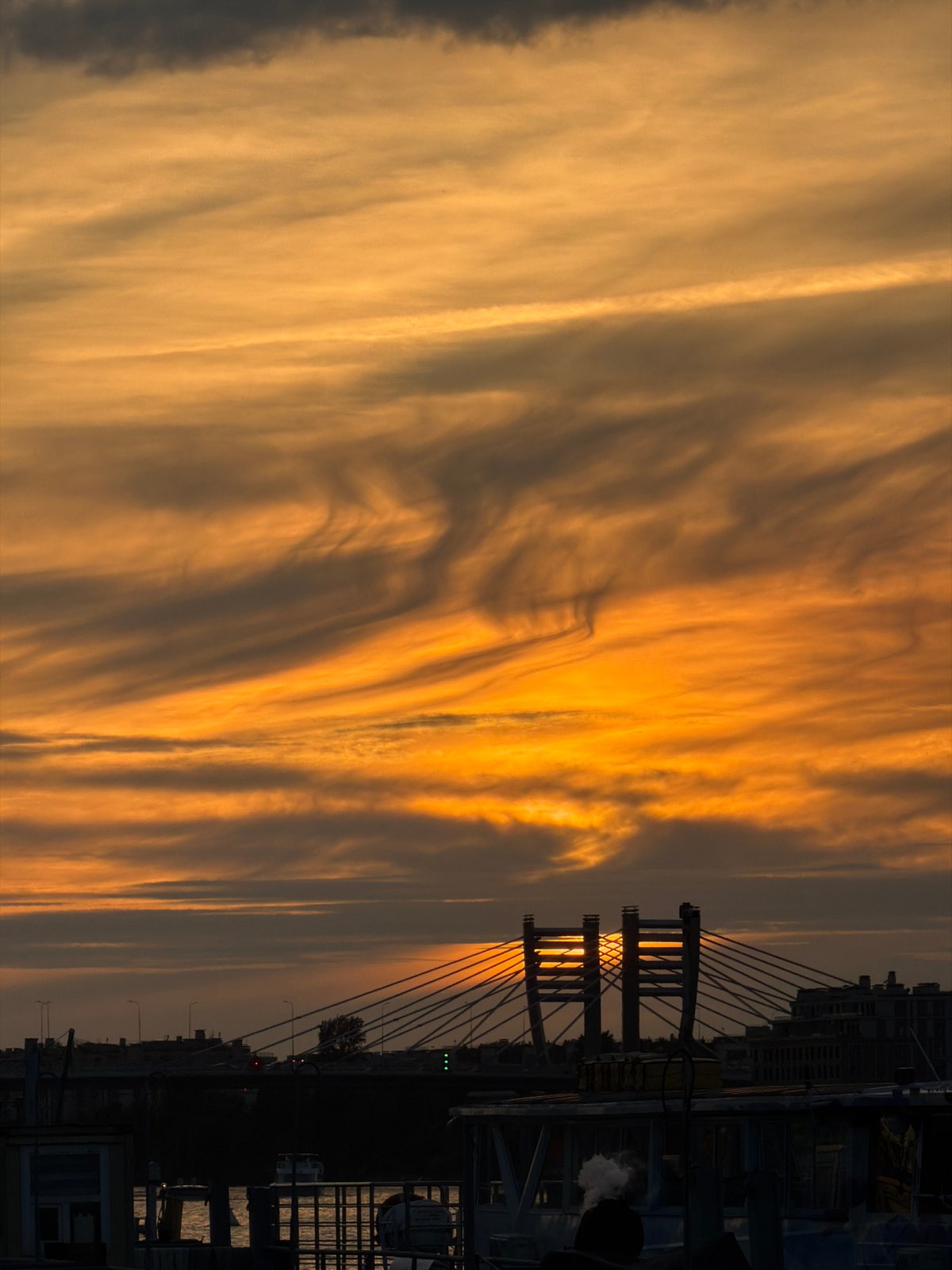 Evening riverside life captured along Saint Petersburg's Neva River embankments