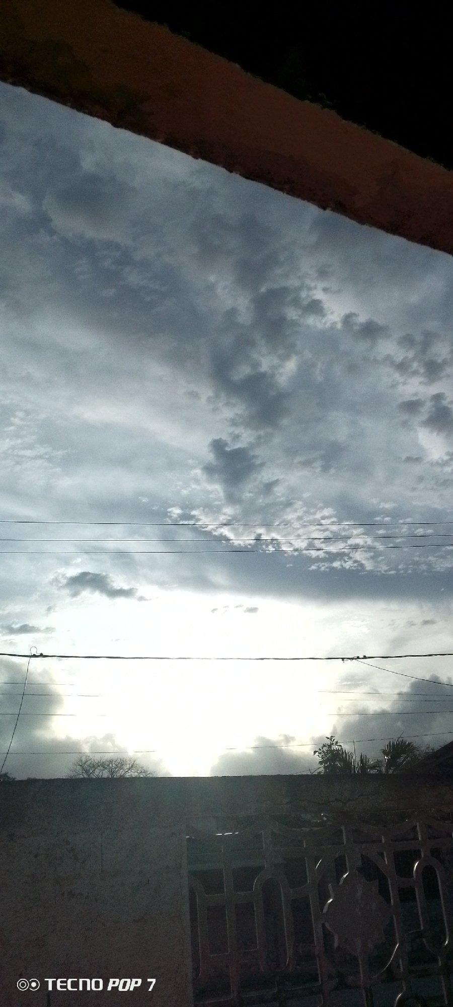 Resident documents cloudy skies over Altagracia, Venezuela neighborhood