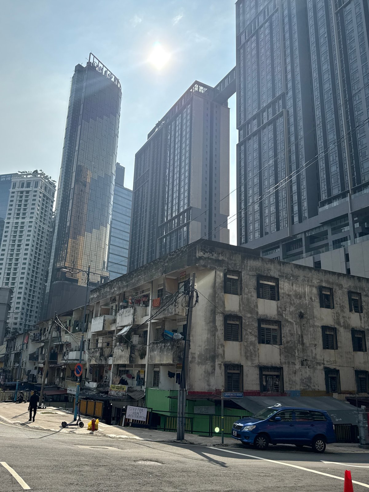 Kuala Lumpur street scenes show modern towers amid older buildings