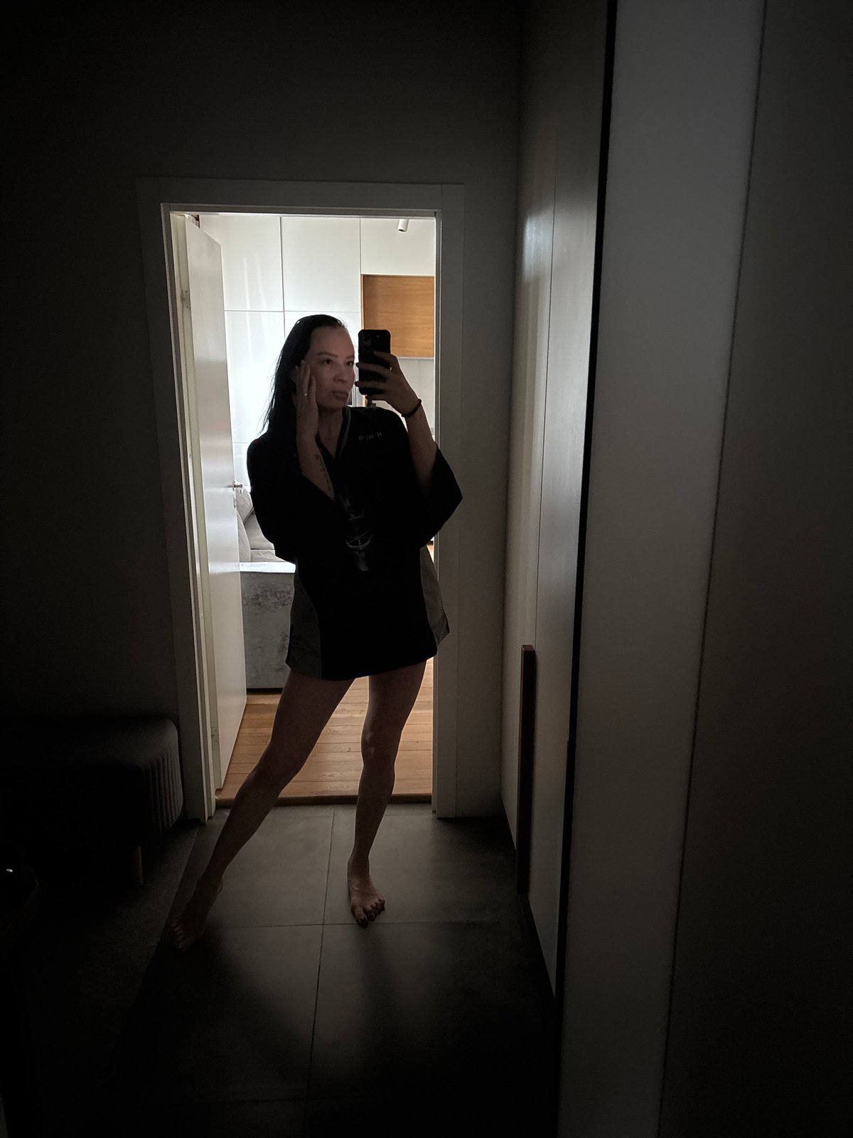Woman takes selfie in doorway in Chaikovsky, Russia