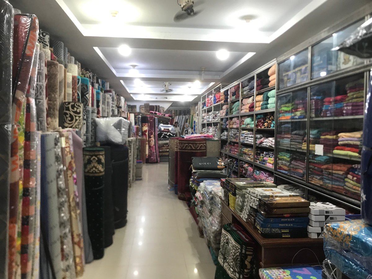 Textile shop displays carpets and fabrics in Banda Aceh