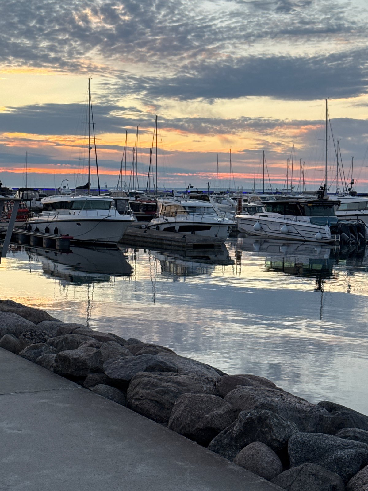 Tallinn marina at sunset, boats docked and sky ablaze