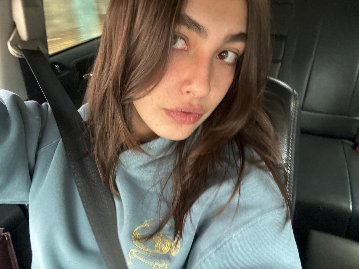 Woman in blue sweatshirt photographed in vehicle, Mexico City