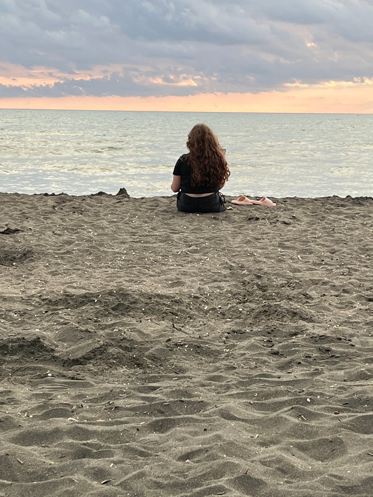 Sunset hour on Ureki's black sand beach